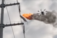 Drone clearing plastic debris off of power lines. Image from Businessinsider.com